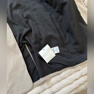 NWT DKNY trench with leather sleeves.